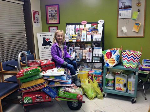 This young lady collected pet food donations for the Humane Society in lieu of gifts for her birthday, which is a great way to support the pet food bank. The pet food bank serves low income families, Humane Society foster families, and local rescue organizations when overstock permits. (Humane Society of Clarksville-Montgomery County)