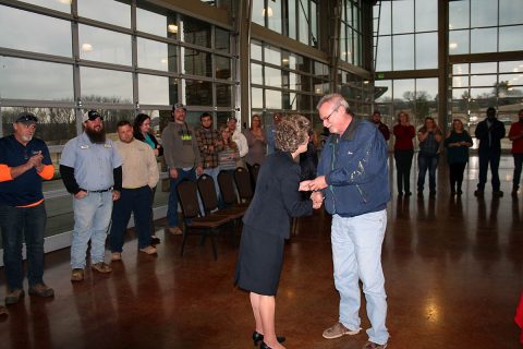 Michael McWhorter, Materials Management Supervisor at Clarksville Gas and Water, accepts a 45-year service pin from Clarksville Mayor Kim McMillan. He was the longest serving of the 285 City employees who received pins from McMillan during her annual employee service awards breakfast on Thursday. 