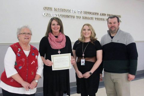 MCES recognized with Point of Pride at School Board meeting. From left, retired MCES principal Nancy Grant, Principal Loralee BeCraft, Assistant Principal Roshae Harrison, School Board member Josh Baggett.