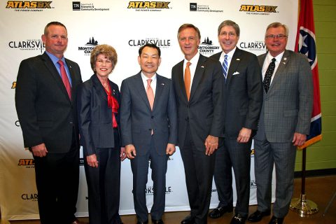 Tennessee Governor Bill Haslam and state and local leaders join ATLASBX CEO Ho Youl Pae after an announcement that ATLAS BX will build a $75 million battery manufacturing plant in Clarksville.