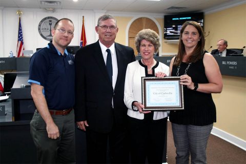 Gerald Parrish, Tennessee Department of Environment and Conservation official, recently presented Clarksville Parks and Recreation Department with a Tier III benchmarking certificate, signifying a high level of services and performance. Taking part in the presentation were, from left, Dan Carpenter, assistant parks director; Parrish; Clarksville Mayor Kim McMillan; and Parks & Recreation Director Jennifer Letourneau.