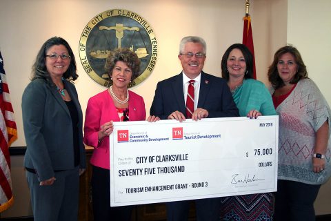 Kevin Triplett, Commissioner of Tourist Development, presented a $75,000 grant to City of Clarksville and Convention and Visitors Bureau officials on Monday. They are, from left, City Grants Administrator Debbie Smith, Clarksville Mayor Kim McMillan, Michelle Dickerson and Francis Mancito.