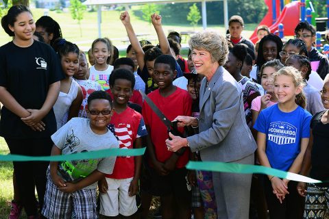 Clarksville Mayor Kim McMillan, joined by more than 50 children and staff from the Kleeman Community Center, cut a ribbon during the ribbon cutting ceremony at Bel-Aire Park June 7th, 2018. The ceremony marked the official reopening of the park, after it received much needed equipment upgrades. Improvements include a new playground that meets the current guidelines under the Americans with Disabilities Act.