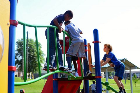 Children from the Kleeman Community Center enjoy the newly renovated Bel-Aire Park after the ribbon cutting ceremony June 7th, 2018. 
