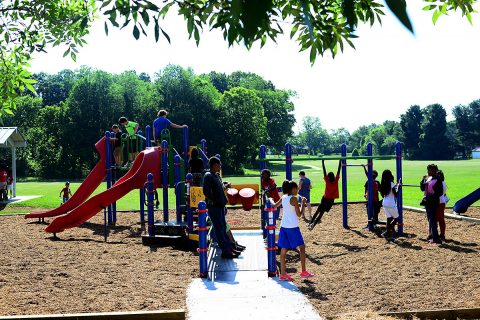 Children from the Kleeman Community Center enjoy the newly renovated Bel-Aire Park after the ribbon cutting ceremony June 7th, 2018. The ceremony marked the official reopening of the park, after it received much needed equipment upgrades.