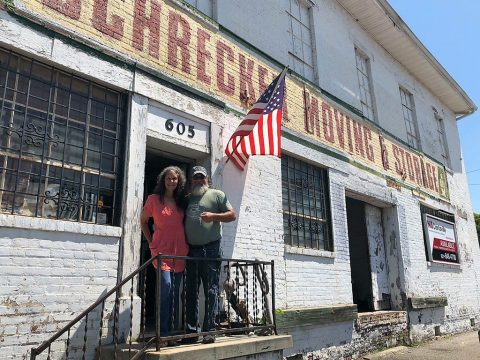 Manna Café's Kenny York and Victoria York in front of property that will become The Manna Village.