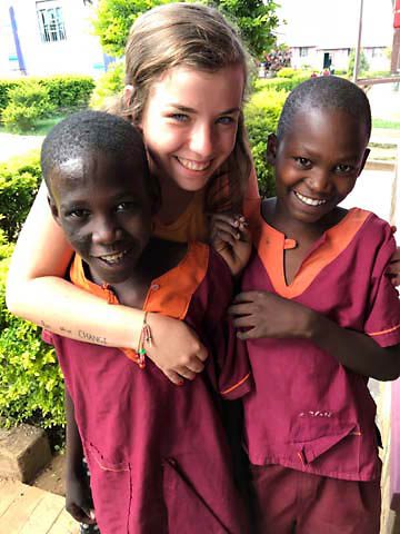 Mallory Fundora spends time with Elvis and Kalvin in Uganda.