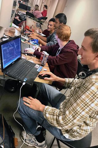 Austin Peay State University ACM members Daniel Blankenship, Aidan Murphy, Parth Patel and Zack Toupe work on their hack.