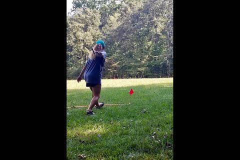 Jeanette Williams readies to throw a rock hammer. She earned first place in the event.