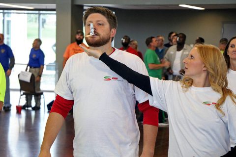 Members of CDE Lightband team Killa Watts, which took first place out of 12 six-member City of Clarksville employee teams, carefully walks across the Wilma Rudolph Event Center during the 2nd Annual United Way Field Day event October 16th, 2018. 