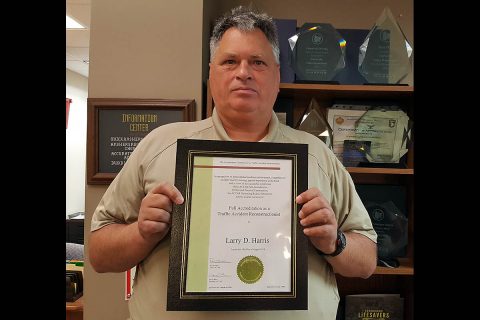 Clarksville Police Officer Larry Harris with his Traffic Accident Reconstructionist Accreditation. Clarksville Police Officer Larry Harris with his Traffic Accident Reconstructionist Accreditation.
