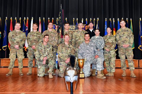 Standing from the left are Paul Kearney, Braydon Donnell, Alden Marvin, Thomas Rose, Steven Price, coach Keith Colman, Jasmine Barrios, Kylie Head, Brendan Hagens; kneeling from the left are Daniel Cole, Wesley Gray and Thomas Porter.