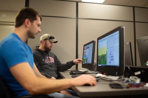 Austin Peay State University Computer science students Connar Bielinski and Kevin Lyons work on their simulations.