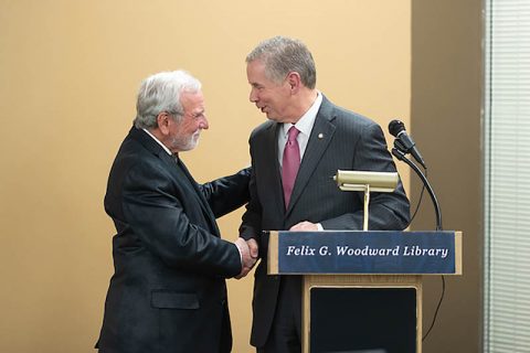 Clarksville Mayor Joe Pitts honors retired Austin Peay State University professor Glenn Carter for his service to APSU.