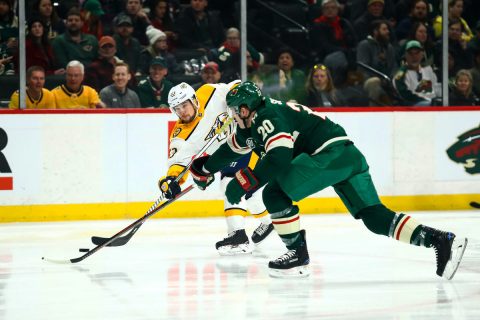 Mar 3, 2019; Saint Paul, MN, USA; Nashville Predators right wing Viktor Arvidsson (33) shoots the puck against Minnesota Wild defenseman Ryan Suter (20) in the first period at Xcel Energy Center. Mandatory Credit: David Berding-USA TODAY Sports