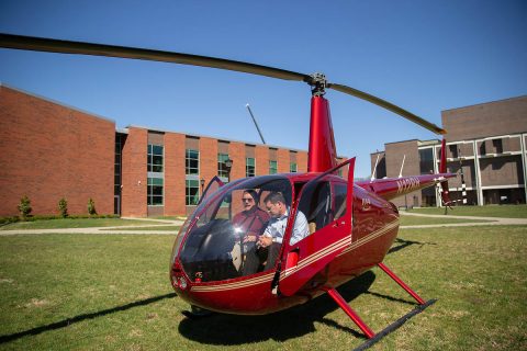 Austin Peay State University aviation science program director and chief pilot Charlie Weigandt shows GOV 3 to U.S. Rep. Mark Green. GOV 3 is one of three in APSU's helicopter fleet. (APSU)