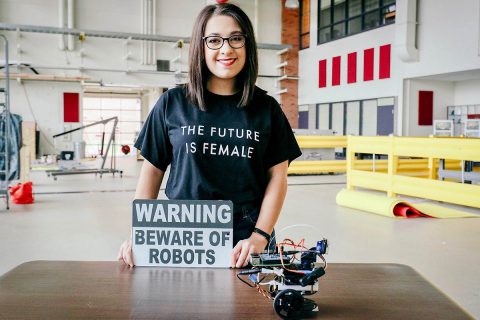 Recent Austin Peay State University computer science graduate Jordan Miller displays her robot in the Technology Building on campus. (APSU)