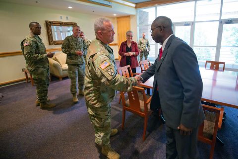 Lt. Col. John Rigdon, commander for the Recruiting and Retention Battalion of the Tennessee Army National Guard, greets retired Lt. Gen. Ronald Bailey, vice president for External Affairs at Austin Peay State University. (APSU)