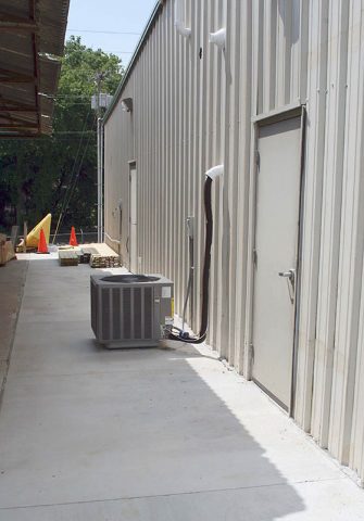 The Grounds and Facilities Maintenance project included upgrading the HVAC system and pouring new concrete between new and old buildings at the workplace.