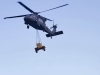 A UH-60 flies over to training area five from training area 12 after Soldiers from 58th Signal Company, 101st Special Troops Battalion, 101st Airborne Division (Air Assault), sling load a generator onto the aircraft on Fort Campbell, Ky., March 14, 2016. Soldiers from 58th Sig. Company will commence a one week long field training exercise which will test their tactical and technical skills. (U.S. Army Sgt. Neysa Canfield, 101st Sustainment Brigade Public Affairs)