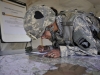 Sgt. Alisa Ryder, a health care specialist, with the Company C, 526th Brigade Support Battalion, 2nd Brigade Combat Team, 101st Airborne Division (Air Assault), plots points on a map at a range here prior to the land navigation course event of the divisionâ??s 2015 Soldier and noncommissioned officer of the year competition April 23, 2015. The three-day competition pitted Soldiers from across the division against each other in numerous events, which culminated in a board held by the divisionâ??s senior noncommissioned officers. (U.S. Army photo Staff Sgt. Joel Salgado, 3rd Brigade Combat Team, 101st Airborne Division (Air Assault) Public Affairs)