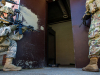 Soldiers from 3rd Brigade Combat Team, 101st Airborne Division (Air Assault) launch a surveillance robot into a unknown section of the subterranean training area to check what is behind doors and corners July 27 on Fort Campbell, KY. (Sgt. Patrick Kirby, 40th Public Affairs Detachment)