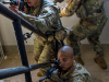 Sgt. Edward Orr, Sgt. Benjamin Georgia and Sgt. Jack Purcell, infantrymen from Whiskey Co., 2nd Battalion, 506th Infantry Regiment, 3rd Brigade Combat Team, 101st Airborne Division (Air Assault) clear and maneuver through a stair well while conducting subterranean training, July 25 on Fort Campbell, KY. (Sgt. Patrick Kirby, 40th Public Affairs Detachment)