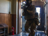 Soldiers from 3rd Brigade Combat Team, 101st Airborne Division (Air Assault) enter through a door that was cut open by the breach team and enter the subterranean training area July 27 on Fort Campbell, KY. (Sgt. Patrick Kirby, 40th Public Affairs Detachment)