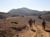 Soldiers from Second Platoon, Company A, 3rd Special Troops Battalion, 3rd Brigade Combat Team “Rakkasans,” 101st Airborne Division (Air Assault), move down the road to their vehicles after conducting a key leader engagement with Afghan Uniformed Police at a checkpoint near Forward Operating Base Salerno, Afghanistan, Dec. 10, 2012. They were meeting with a company commander of the AUP before distributing humanitarian aid at a village within the Khowst district. (U.S. Army photo by 1st Lt. John Zaehringer, 3rd STB Unit Public Affairs Representative)