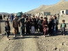 Villagers gather to receive various items during a humanitarian aid distribution mission near Forward Operating Base Salerno, Afghanistan, Dec. 10, 2012. Soldiers from Company A, 3rd Special Troops Battalion, 3rd Brigade Combat Team “Rakkasans,” 101st Airborne Division (Air Assault), assisted the Afghan Uniformed Police in distributing school supplies for the local school children in order to build relations between the village and the AUP. (U.S. Army photo by 1st Lt. John Zaehringer, 3rd STB Unit Public Affairs Representative)