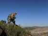 1st Lt. Jerry Hodge, an infantry officer assigned to Company C, 3rd Battalion, 187th Infantry Regiment, 3rd Brigade Combat Team “Rakkasans,” 101st Airborne Division (Air Assault), peers into the valley below for signs of insurgent activity near Combat Outpost Bowri Tana, Afghanistan. (U.S. Army photo by Sgt. 1st Class Abram Pinnington, Task Force 3/101 Public Affairs)