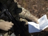 U.S. Air Force Maj. Ryan Schenk, 621st Mobility Support Operations Squadron air mobility liaison officer assigned to the 101st Airborne Division at Fort Campbell, Ky., reviews the transfer of authority checklist while waiting for the airfield to be cleared during a mobility exercise called WAREX at Joint Base McGuire-Dix-Lakehurst, N.J., March 13, 2017. (U.S. Air Force Tech. Sgt. Gustavo Gonzalez)