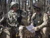 U.S. Air Force Maj. Ryan Schenk, 621st Mobility Support Operations Squadron air mobility liaison officer assigned to the 101st Airborne Division at Fort Campbell, Ky., reviews the transfer of authority checklist with Capt. U.S. Army Capt. Travis Seale, a 101st Abn. Div. soldier, while waiting for the airfield to be cleared during a mobility exercise called WAREX at Joint Base McGuire-Dix-Lakehurst, N.J., March 13, 2017. (U.S. Air Force Tech. Sgt. Gustavo Gonzalez)