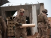 U.S Army Spc. Jacob Breitbach, Battery C, 1st Battalion, 320th Field Artillery Regiment, Task Force Strike, moves to load charges into an M777 howitzer during a fire mission to support the Iraqi security forces in the Mosul counter offensive, Dec. 24, 2016, in northern Iraq. Battery C is supporting the Iraqi security forces with indirect fires in their fight against ISIL.(U.S. Army photo by 1st Lt. Daniel Johnson)