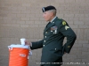 A soldier takes a moment to get a drink 