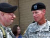 Maj. Gen. Schloesser gives a battle scarred soldier a look of respect