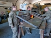 Soldiers from E Troop, 2nd Squadron, 17th Cavalry Regiment flip a steel fram into position onto a metal plate that will serve as a door in a gate on Forward Operating Base fenty, Afghanistan Dec. 11. (U.S. Army photo by Sgt. Duncan Brennan, 101st CAB public affairs)