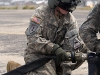 Spc. Danielle Taylor, a flight engineer and a fuel handler instructor with 2nd General Support Aviation Battalion, 501st Aviation Regiment, 1st Armored Division Aviation Brigade, from Fort Bliss, Texas, teaches a fuel handlerâ??s class to Soldiers from the 101st Sustainment Brigade, Task Force Lifeliners, Joint Forces Command - United Assistance, deployed in support of Operation United Assistance at Roberts International Airport outside of Monrovia, Liberia, Jan. 15, 2014. The training teaches Soldier how to implement the versatile Cargo Helicopter 47 (CH-47) Chinook extended range fuel system, known as the â??Fat Cow,â? which is used in environments where there is an urgent need for fuel distribution. Operation United Assistance is a Department of Defense operation in Liberia to provide logistics, training and engineering support to U.S. Agency for International Development-led efforts to contain the Ebola virus outbreak in western Africa. (U.S. Army photo by Sgt. 1st Class Mary Rose Mittlesteadt, 101st Sustainment Brigade Public Affairs/Released)