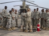 Spc. Danielle Taylor, a flight engineer and a fuel handler instructor with 2nd General Support Aviation Battalion, 501st Aviation Regiment, 1st Armored Division Aviation Brigade, from Fort Bliss, Texas, teaches a fuel handlerâ??s class to Soldiers from the 101st Sustainment Brigade, Task Force Lifeliners, Joint Forces Command - United Assistance, deployed in support of Operation United Assistance at Roberts International Airport outside of Monrovia, Liberia, Jan. 15, 2014. The training teaches Soldier how to implement the versatile Cargo Helicopter 47 (CH-47) Chinook extended range fuel system, known as the â??Fat Cow,â? which is used in environments where there is an urgent need for fuel distribution. Operation United Assistance is a Department of Defense operation in Liberia to provide logistics, training and engineering support to U.S. Agency for International Development-led efforts to contain the Ebola virus outbreak in western Africa. (U.S. Army photo by Sgt. 1st Class Mary Rose Mittlesteadt, 101st Sustainment Brigade Public Affairs/Released)