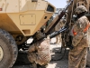 Sgt. 1st Class Antonio D. Green, a native of Aiken, S.C., and an inspector, observes Sgt. Travis Broussard, a native of Lafayette, La., and a recovery operator, as he demonstrates to the Polish forces the proper way to recover a broken down vehicle during master driver training, Aug. 7, 2013 at Bagram Air Field, Parwan province, Afghanistan. They are using the American heavy expanded tactical truck, A4 wrecker, to recover the Polish Rosomak vehicle as part of this training. Both soldiers are with the 536th Support Maintenance Company, 157th Combat Sustainment Support Battalion in support of Task Force Lifeliner. (U.S. Army photo by Sgt. Sinthia Rosario, Task Force Lifeliner Public Affairs)