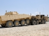 The heavy expanded tactical truck, a recovery vehicle also known as the A4 wrecker, tows away the Rosomak Polish vehicle during the Polish master driver training Aug. 7, 2013 at Bagram Air Field, Parwan province, Afghanistan. The Polish forces have experience with the A2 wrecker version but need to learn the new characteristics and buttons of the A4 wrecker, which is the upgraded model. The soldiers of the 536th Support Maintenance Company, 157th Combat Sustainment Support Battalion in support of Task Force Lifeliner, were the instructors of this training. (U.S. Army photo by Sgt. Sinthia Rosario, Task Force Lifeliner Public Affairs)