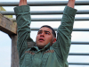 Spc. James Szkola completes the monkey-bars obstacle March 15 during the SWAT Challenge at Fort Campbell, Ky. Szkola is a part of the Special Reaction Team, 163rd Military Police Company, 716th MP Battalion, 101st Airborne Division Sustainment Brigade, 101st Abn. Div. (Air Assault). (Spc. Beverly Roche, 40th Public Affairs Detachment)