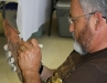 A wood carver working on another piece