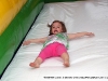 Children sliding down one of the inflatables provided by Go Play! Party Rentals