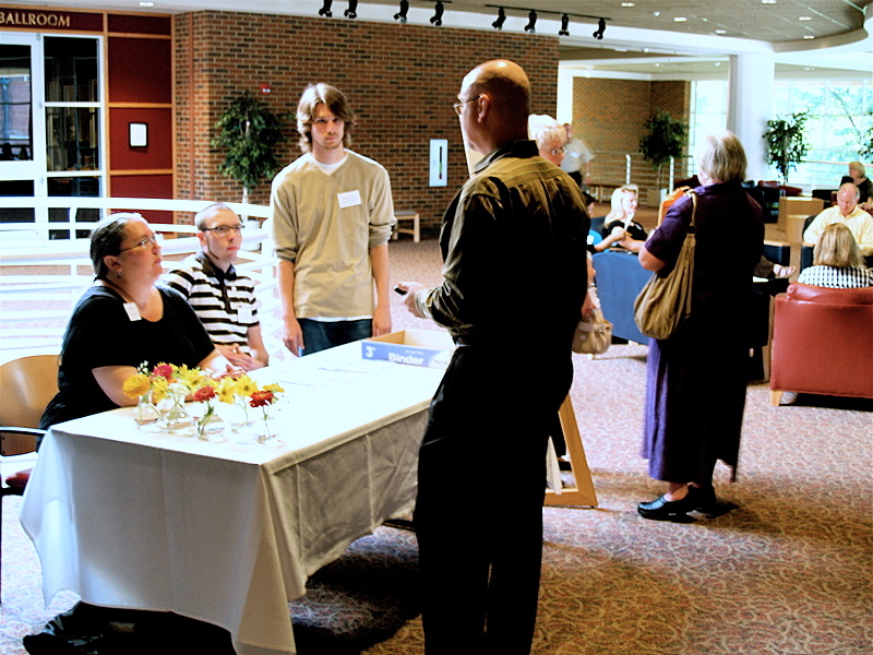 2009 WrtrsConf-1st Day - 01 Registration attendants await conference participants check-in