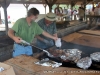 BBQ being taken off of the pit.