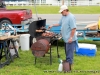 A contestant cooking chicken for entry.