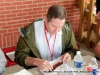 State Senator, Tim Barnes judging a rib entry in the BBQ Cookoff.