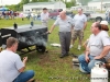 One of the contestants cooking barbecue and selling it to people in the crowd.