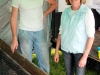 Mike Johnson and Elkie Melton standing behind the BBQ pit that cooked the winning ribs.